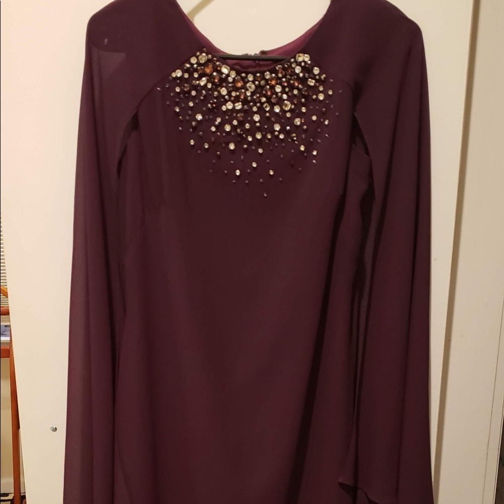 Woman’s maroon Vince Camuto dress